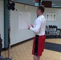 Tricep Pushdown (rope) Coaching Tips: Stand up straight; grab the rope with palms facing in.