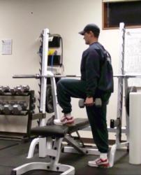 Step down with second leg by flexing hip and knee of first leg.