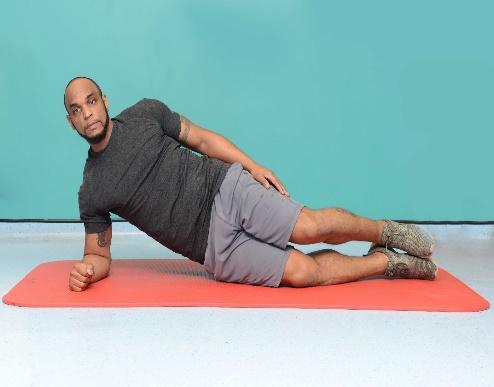 Side planks with bent legs Lie on your side, resting on knees and elbow. Support yourself on your elbow, keeping it in line below the shoulder, and place your free hand on your hip.
