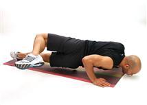 Start prone on the ground with the hands slightly wider that the shoulders. Perform a complete push-up (for description see push-up in Exercise Library).