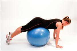 Duration: 6 sec Push-up position with arms slightly bent and stability ball under hips.
