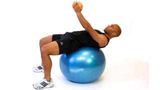 Sit on the stability ball. Slowly roll down the ball until it is in the small of the back. Be sure you are balanced when back is fully extended.