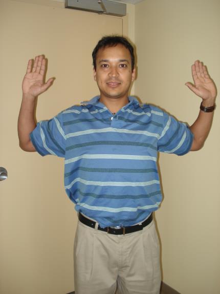 Using left hand, gently pull arm as close to body as possible. Hold stretch and repeat with opposite arm.