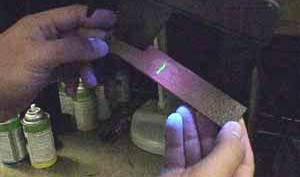A developer (powder) is applied to pull the trapped penetrant out the