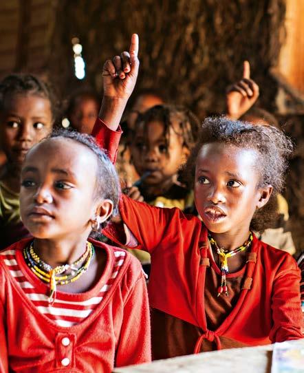 Children like Urji Aliyi (5, front right) from Fugnagdimo/ Ethiopia learn at school,
