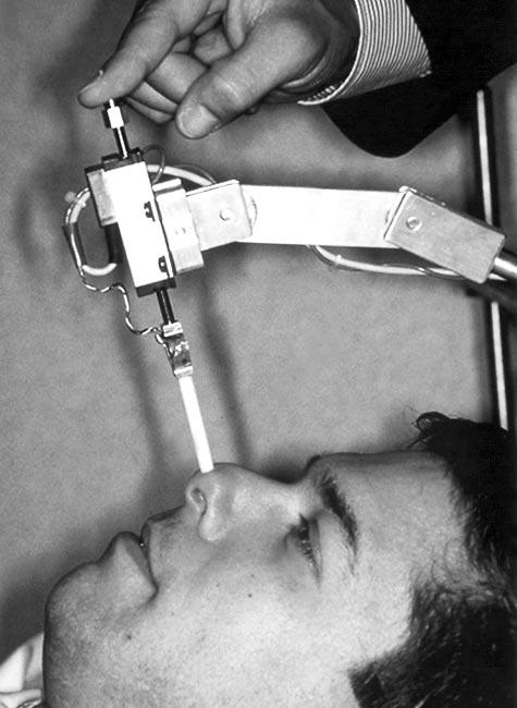 2 1 3 4 Figure 1. Data acquisition occurs with the subject lying in the supine position. The instrument is accurately placed and fixed into position over the subject s nose. Figure 2.