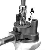 TIBIAL BASEPLATE REAMING Align the Press Fit Reamer Guide or Cemented Reamer Guide through the Tibial Baseplate Punch Guide A IN FIGURE 7.