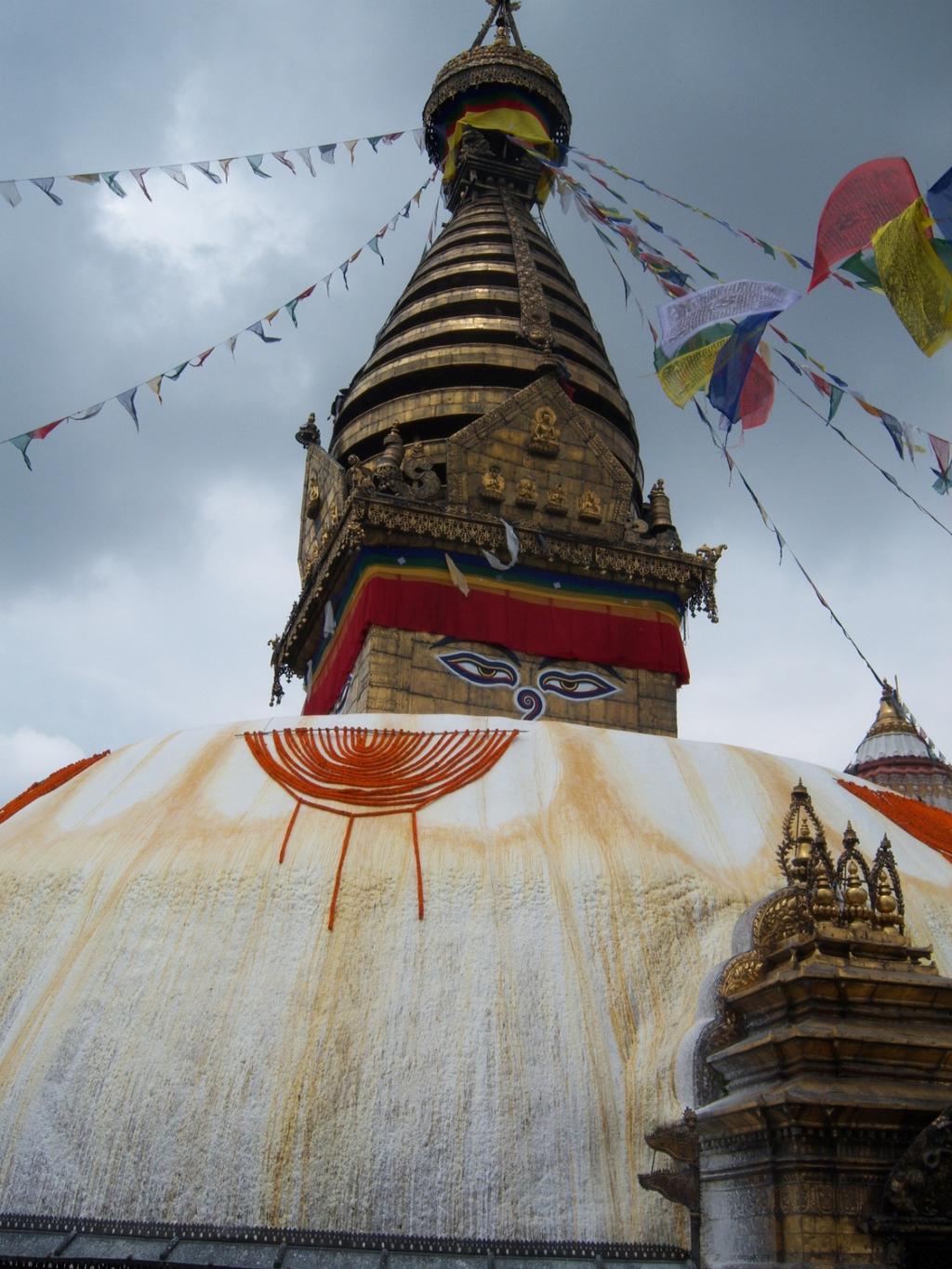 This colorful Buddhist stupa was dressed in Tibetan prayer flags and marigolds for a holy day.