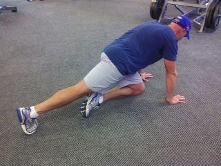 Start in the top of the push-up position.
