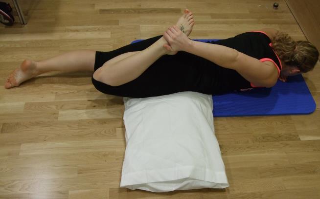 Front of thigh stretch alternative lying down Have a pillow or cushion under your