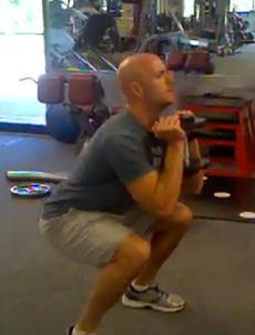 Push your hips backward and sit back into a chair. Make your hips go back as far as possible.