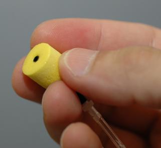 1. Place a new set of foam tips on the earphone tubes as shown.