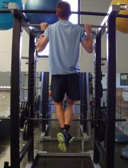 Page 16 of 21 WIDE GRIP PULL UP - Grip the bar with an overhand (pronated) grip. The hands should be slightly wider than shoulder width apart.