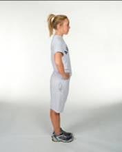 Start by standing in a normal upright position with your hands on your hips.