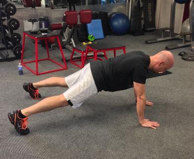 Bodyweight Renegade Row Assume the pushup position with your arms fully extended.