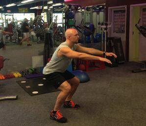 Drive through the heels of your feet and push through your glutes and hamstrings to return to the starting position.