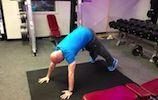 Divebomber Pushups Start with your feet outside shoulder width apart and in the pike pushup position