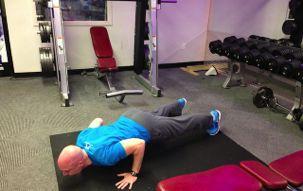 Keeping your hands about shoulder width apart, slowly bring your upper body towards the floor while
