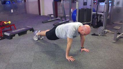 Spiderman Pushup Keep the abs braced and body in a straight line from toes (knees) to shoulders.