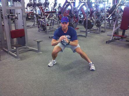 As you maintain a low squat position, step out to the side.