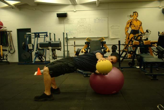 Russian Twist Place your feet flat on the floor with your shoulders on a stability ball.