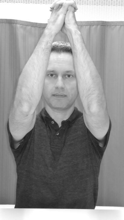 Press hand into ball and roll ball upward on the wall (avoid lifting the ball).
