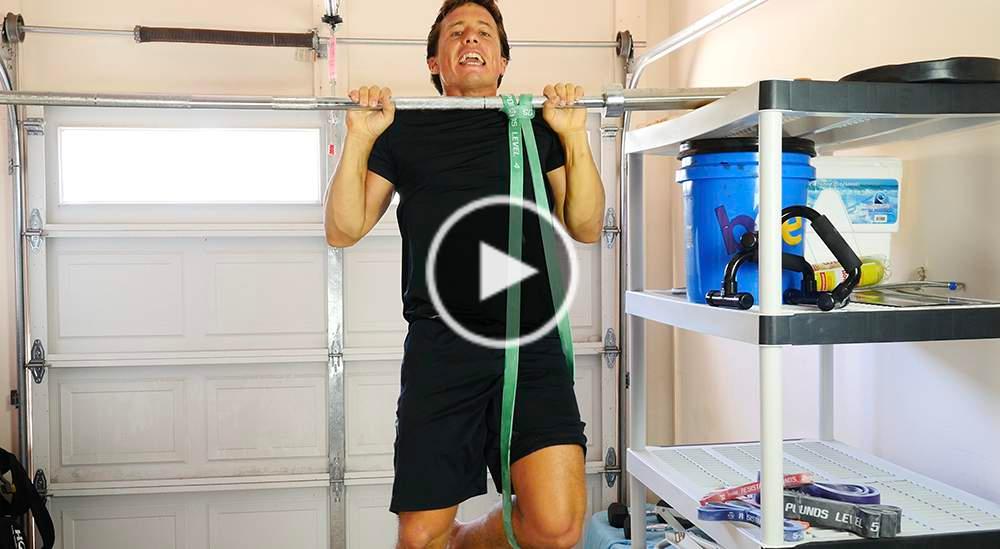 ASSISTED PULL UP PERFORM 3 SETS OF 10 REPS Hang the resistance band over a pull up bar and lace one end through the middle loop, pulling this end all the way down to secure the band around the bar.