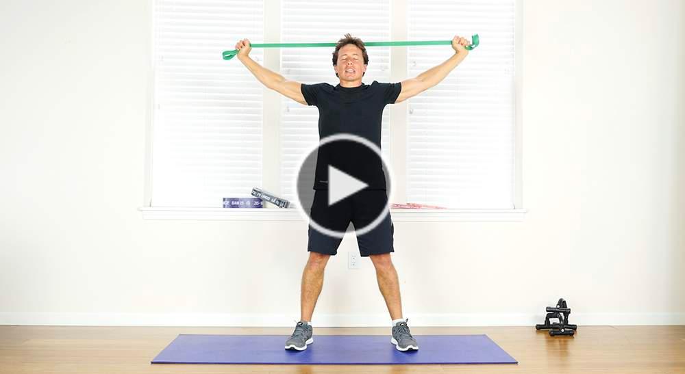 BACK STRETCH PERFORM 1 SET OF 10 REPS Stand with your feet flat on the floor and shoulder width apart. Place one end of your resistance band in each hand.