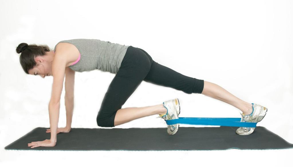 PLANK KNEE THRUSTS (ADVANCED) Step 1: Place the resistance band around your shoes and move into the plank position, with wrists and elbows in line with shoulders, a neutral back and on toes Step 2: