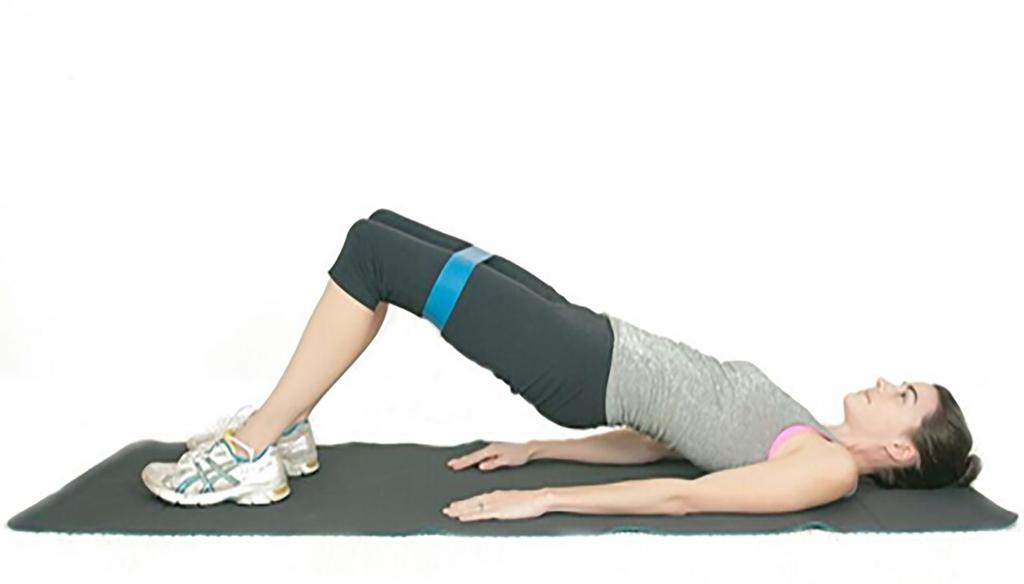 FLOOR BRIDGE (GOOD FOR BEGINNERS) Step 1: Place the resistance band around your thighs, just above your knees.