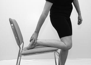 Stand beside a chair and put your lower leg (shin) on the seat of the chair.