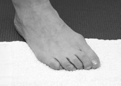Place the ball of your foot on the towel and your heel on the floor.