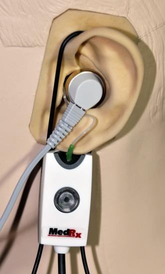 Position the client less than one meter from the speaker and facing the speaker. Place the hearing instrument and the probe microphone tube as for all REM measurements.