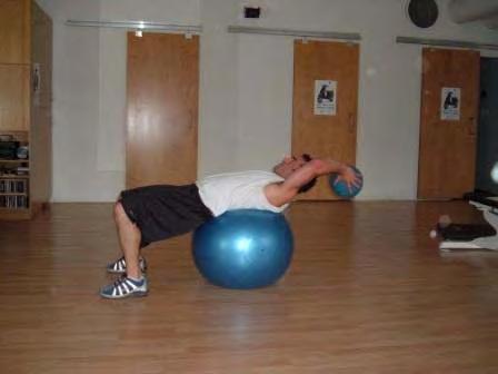 Exercise Descriptions Workout C Stability Ball Ab Crunch with Medicine Ball Lie on the stability ball with your