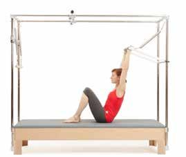 UPPER ARMS BEGINNING 4 REPS Springs: 2 SB or 1 SR & 1SY Position: High Bar/Straps: Push through bar STARTING POSITION Lie supine with the top of your head at the tower end of the table.