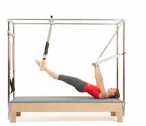 1. Starting position. Feet in the trapeze, hands holding the push thru bar. 2. Pull the bar down and place the upper arms on the table. 3. Press the bar through the uprights. 4.