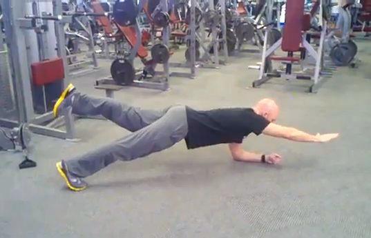 V-Plank Keeping your abs braced, from the plank position,