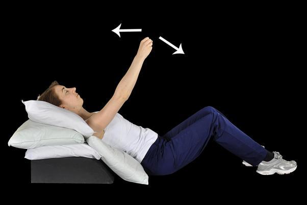 Exercise 4 Half sitting with pillows propped at your back and your knees bent. Lift your arm so that it starts at shoulder height.