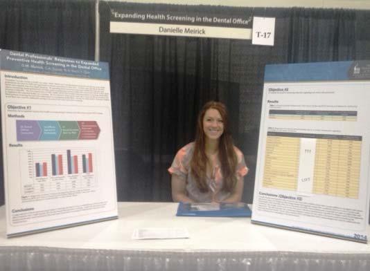 (Right): Danielle Meirick (D2) with her display, Expanding Health Screening