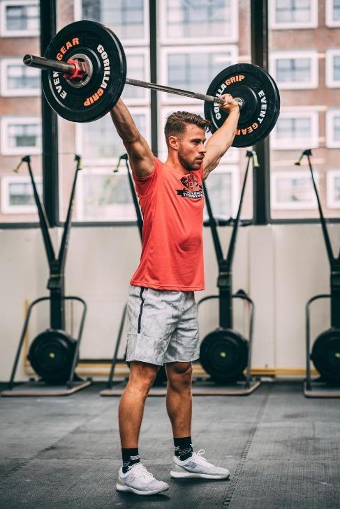 OVERHEAD SQUAT The barbell starts on the ground for the first repetition. The athlete can use a ground-to-overhead or ground-to-shoulder-to-overhead method to get the barbell in the overhead position.