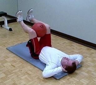 Draw your abs in and squeeze your glutes then slowly raise your shoulders off the floor.