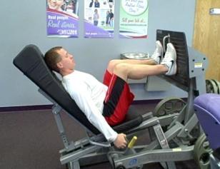 Leg Press Coaching Tips: Sit in the machine with your lower back and head against the seat.