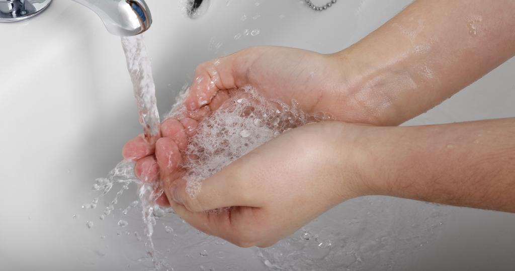Wash hands under running water Wet your hands with clean, warm water, turn off the tap, and apply soap. Lather your hands by rubbing them together with the soap.