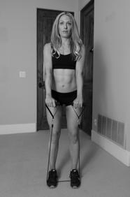 FRONT SHOULDER RAISE SHOULDER EXERCISES 1.) Stand in an upright position, feet over top of the middle of the resistance band. 2.