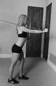 ) Stand 2-3 feet from the door, facing away with one leg in front of the other. 3.) Hold the resistance band with each hand, bringing them to shoulder height level.