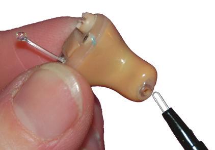 Caution: Do not force a needle Wax or longer wax loop into the hearing loop aid.
