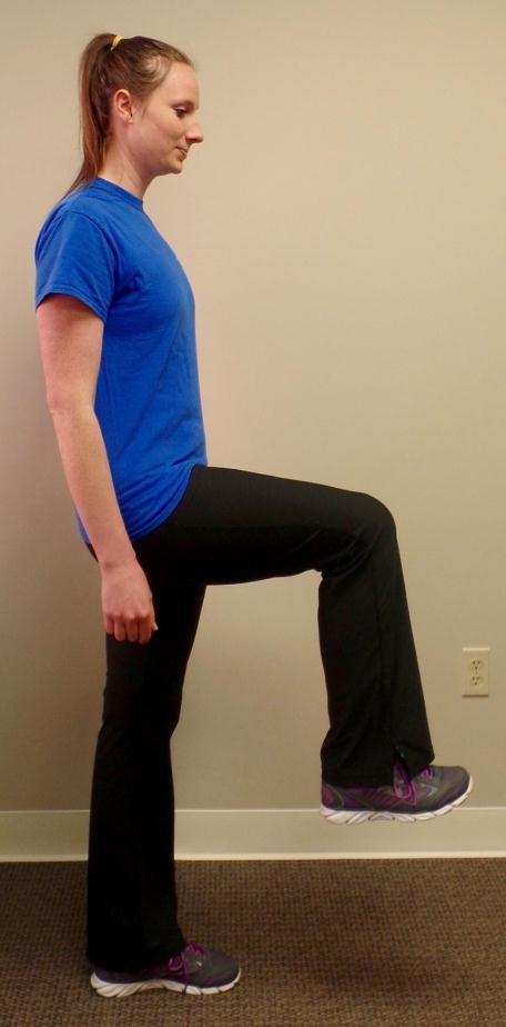 balance. 3. Lower hips and touch knee with hand.