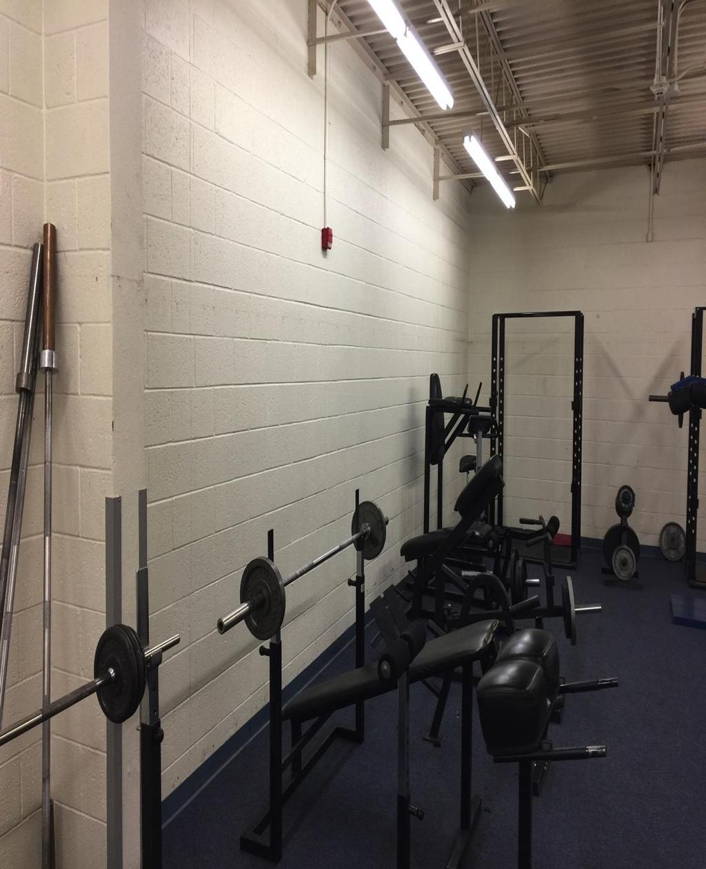 NHS Weight Room Concerns Equipment Spacing: Overall spacing of the equipment in the room is very poor and dangerous No enough space for the 7-foot Olympic