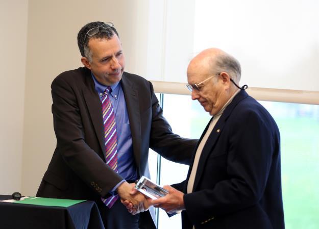 David Rosenberg. Dr. Rosenberg presenting Dr. Cohen with a plaque and thanking him for his invaluable contributions to this department. Dr. Cohen established an endowment earlier this year to support the work of Associate Professor Vaibhav Diwadkar, Ph.