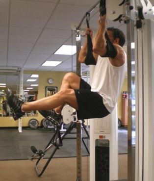 14 Hanging Bicycles - Hang from a pull-up bar (or with arms inside straps) with your legs slightly bent.